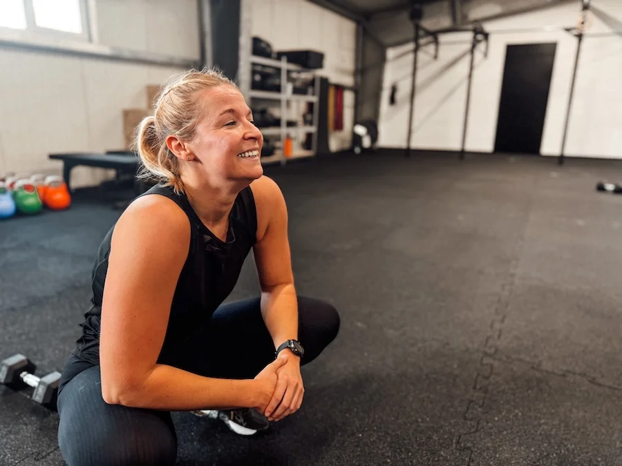 A woman working out at a CrossFit gym