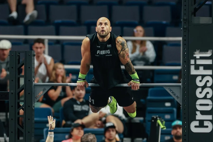 Athlete performing bar muscle-ups