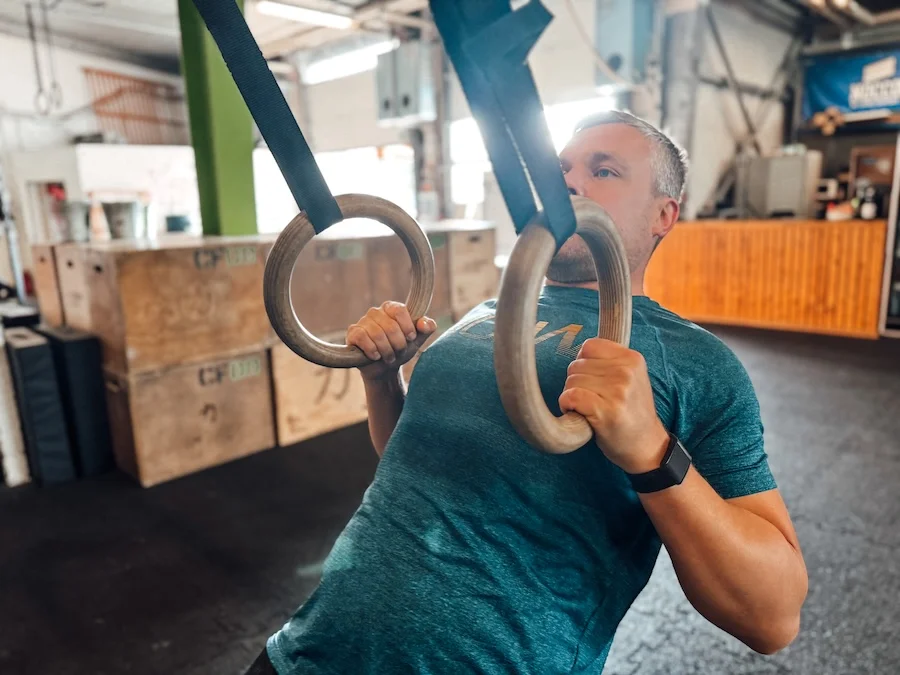 Athlete doing ring rows
