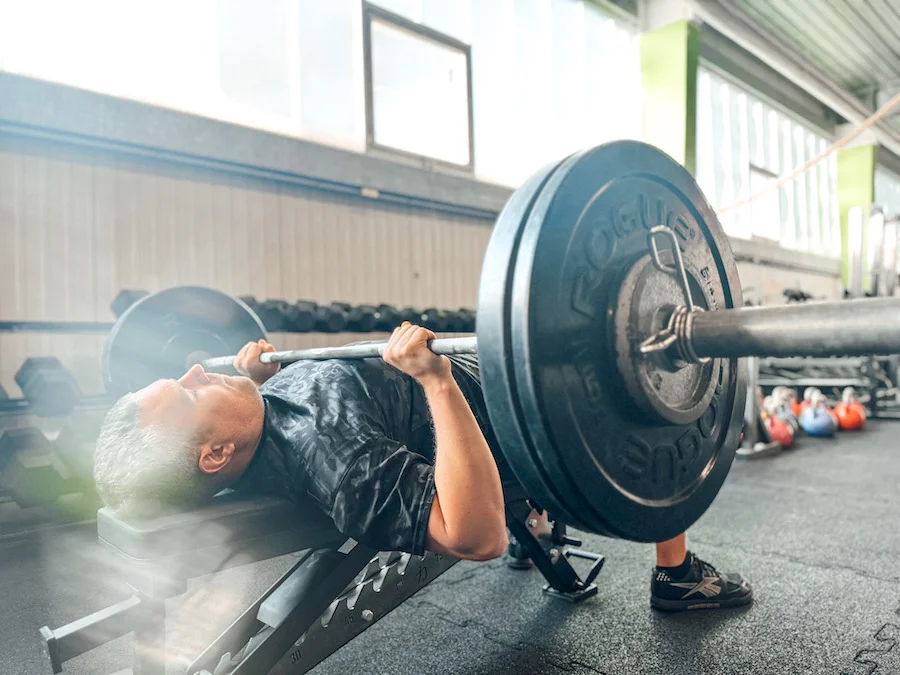 athlete doing a bench press