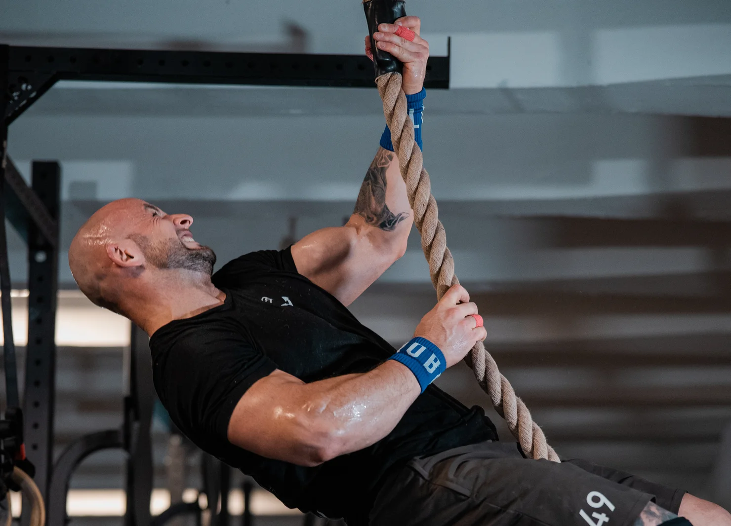 Athlete doing a rope climb