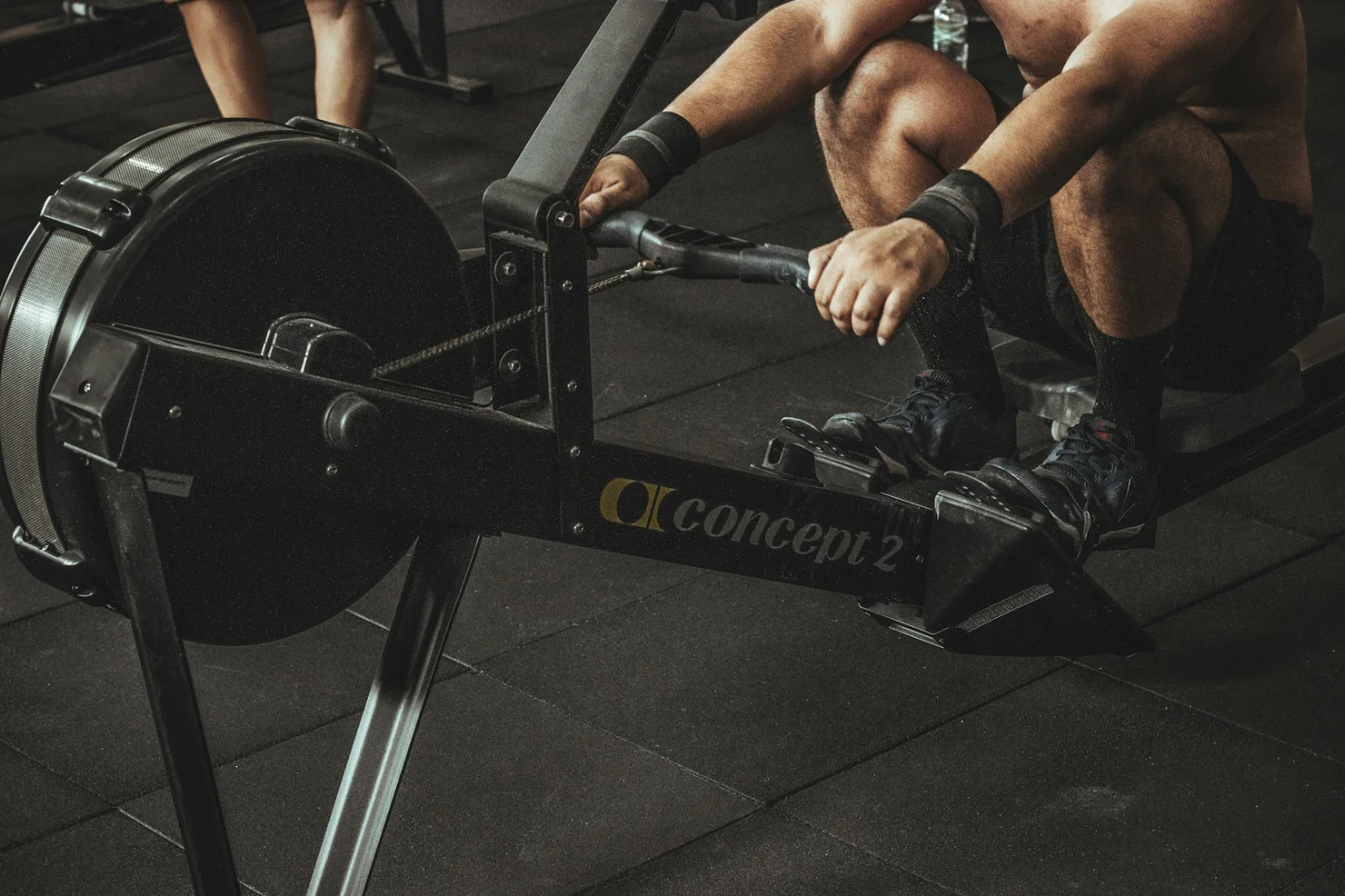 Athlete rowing on a rowing machine.