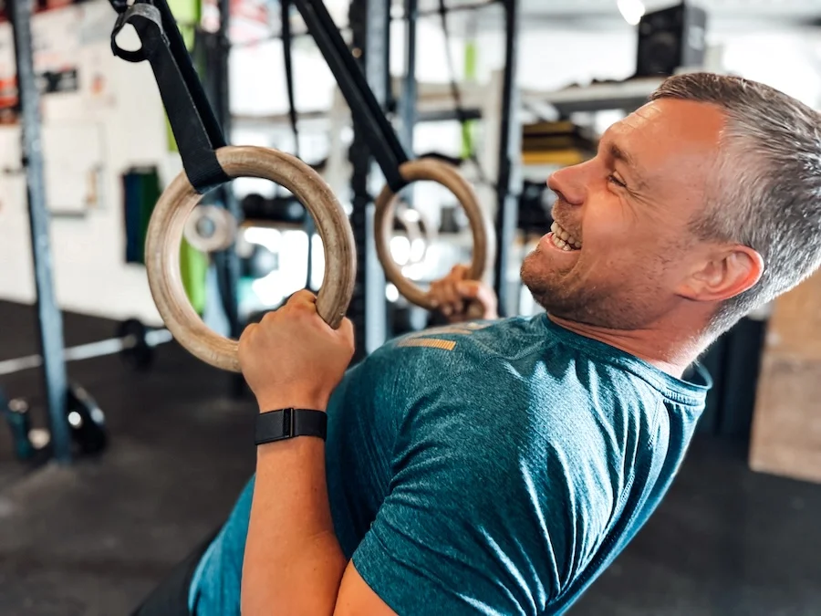 Athlete doing ring rows