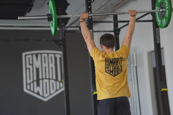Athlete holding a barbell overhead