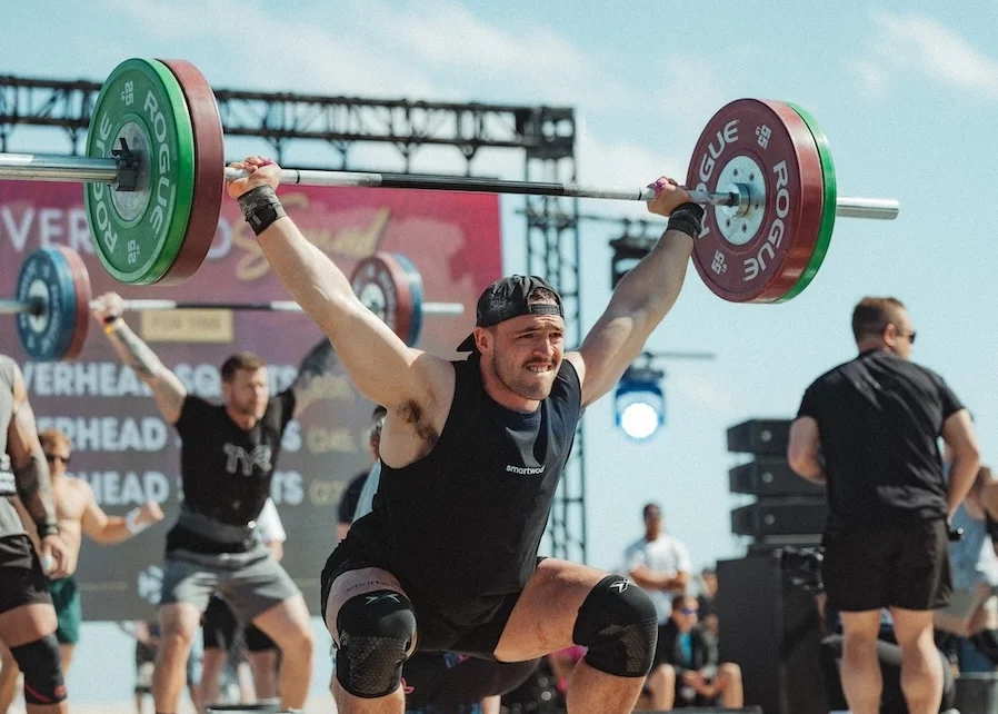 athlete performing a barbell exercise