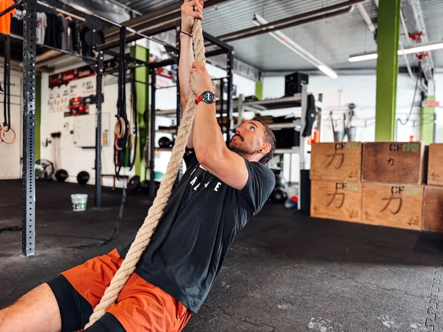 Athlete performing rope pulls