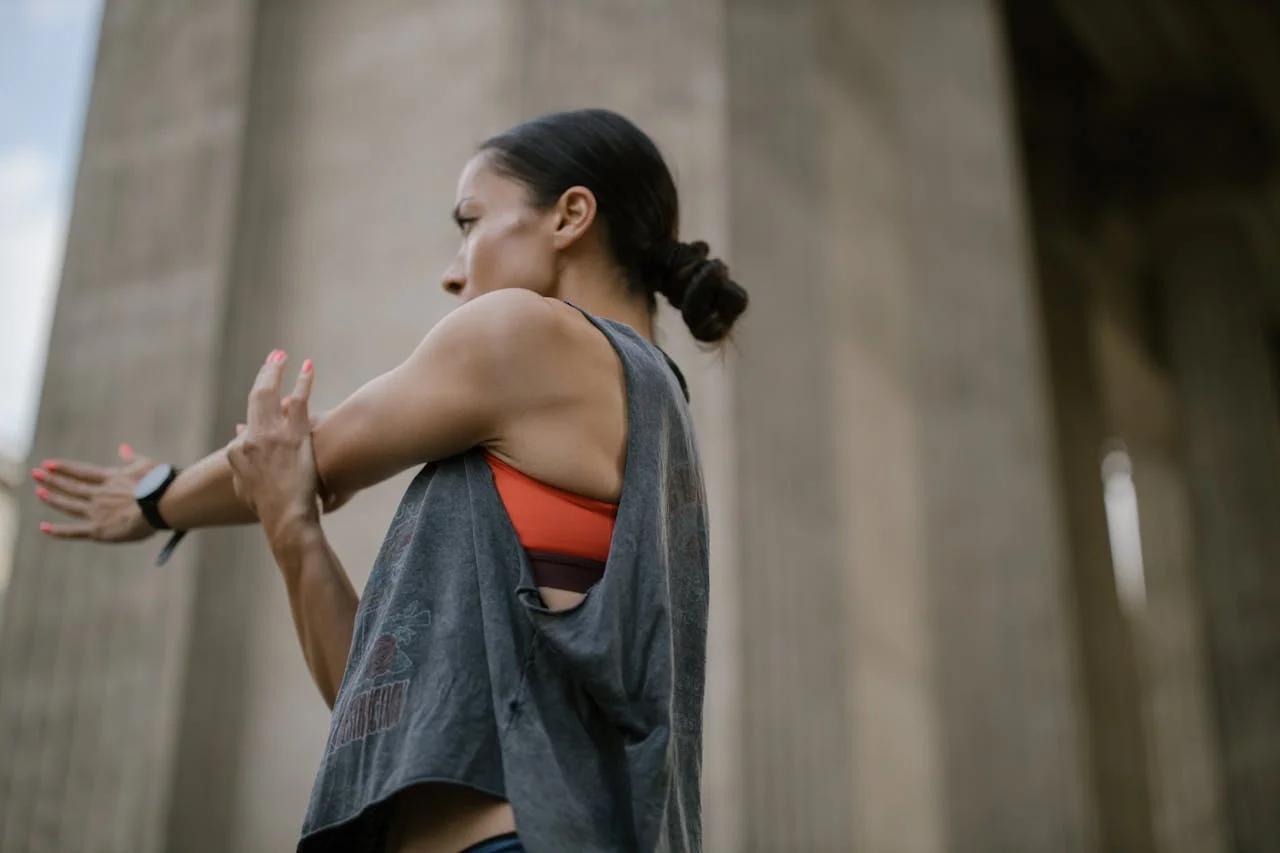 Athlete stretching her shoulders