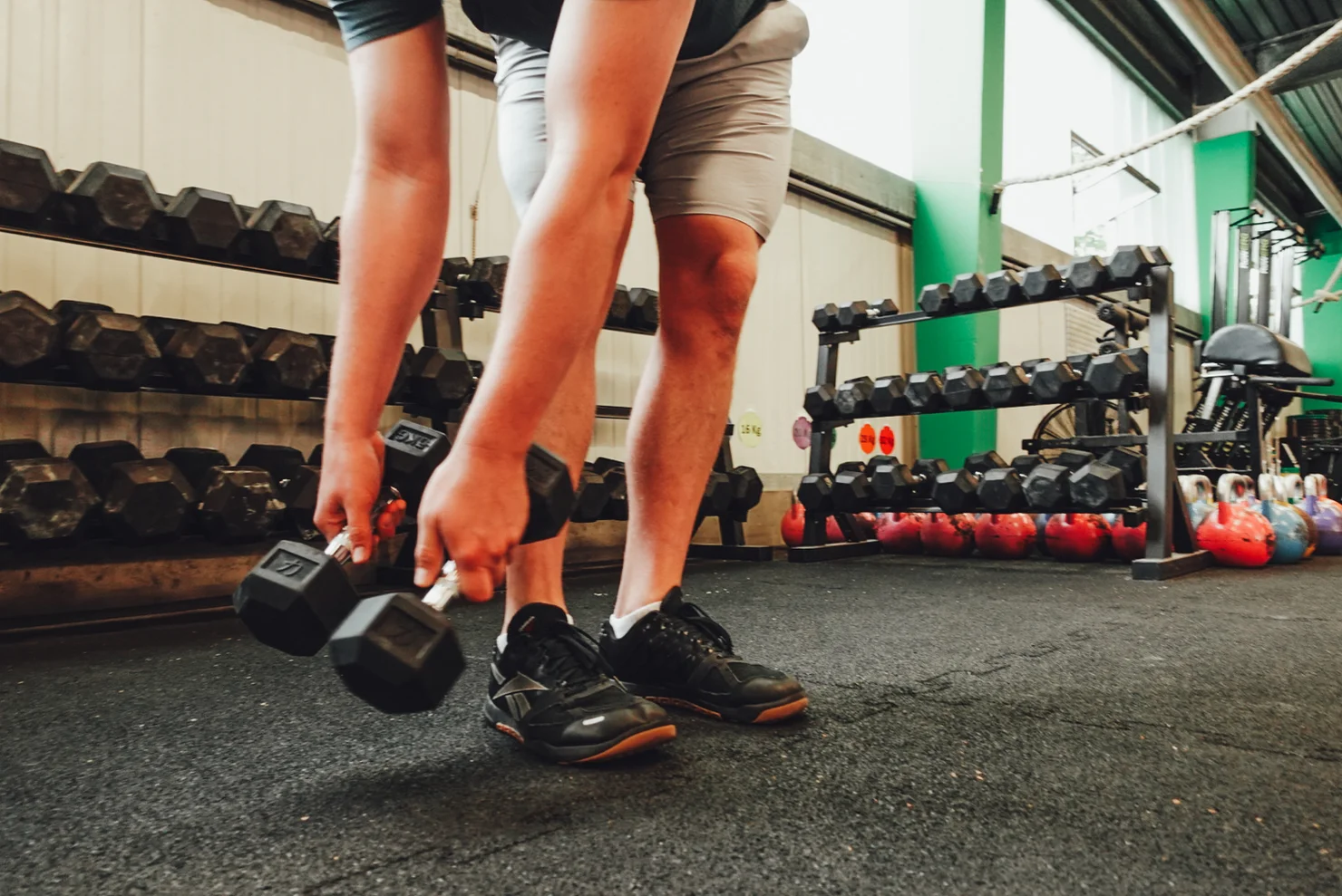 Athlete training with dumbbells
