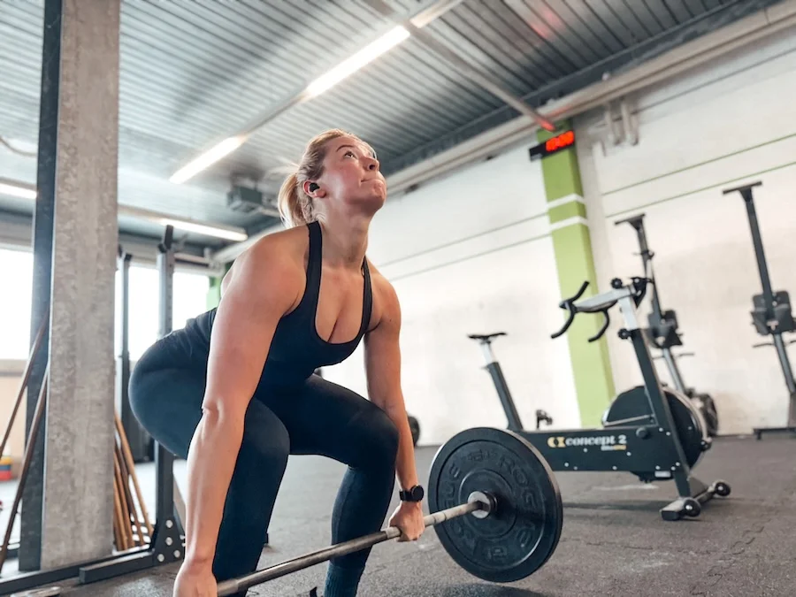 Female athlete doing deadlifts