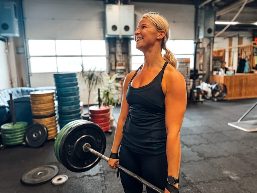 Athletic woman doing deadlifts