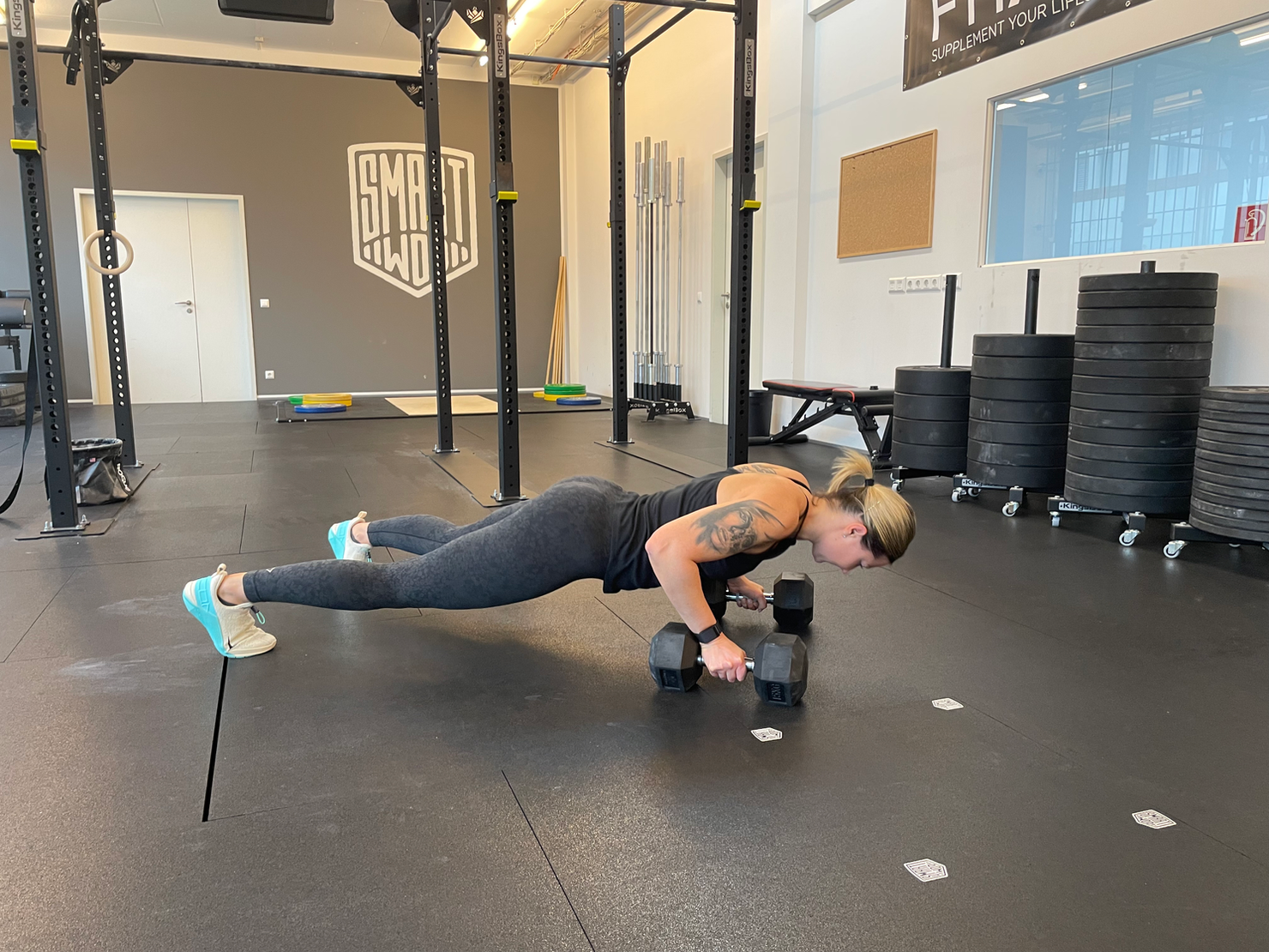 Athlete training with dumbbells