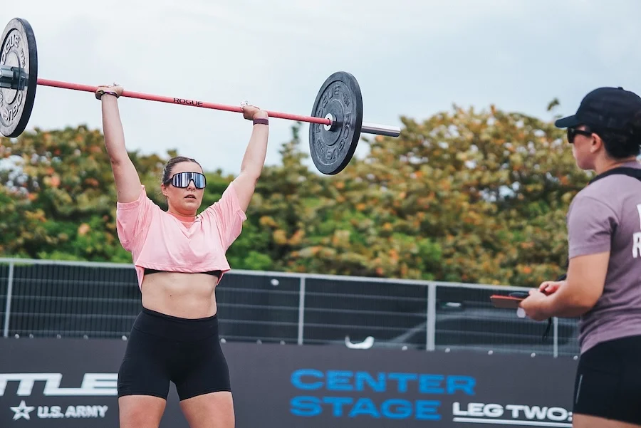 Athlete lifting a barbell overhead