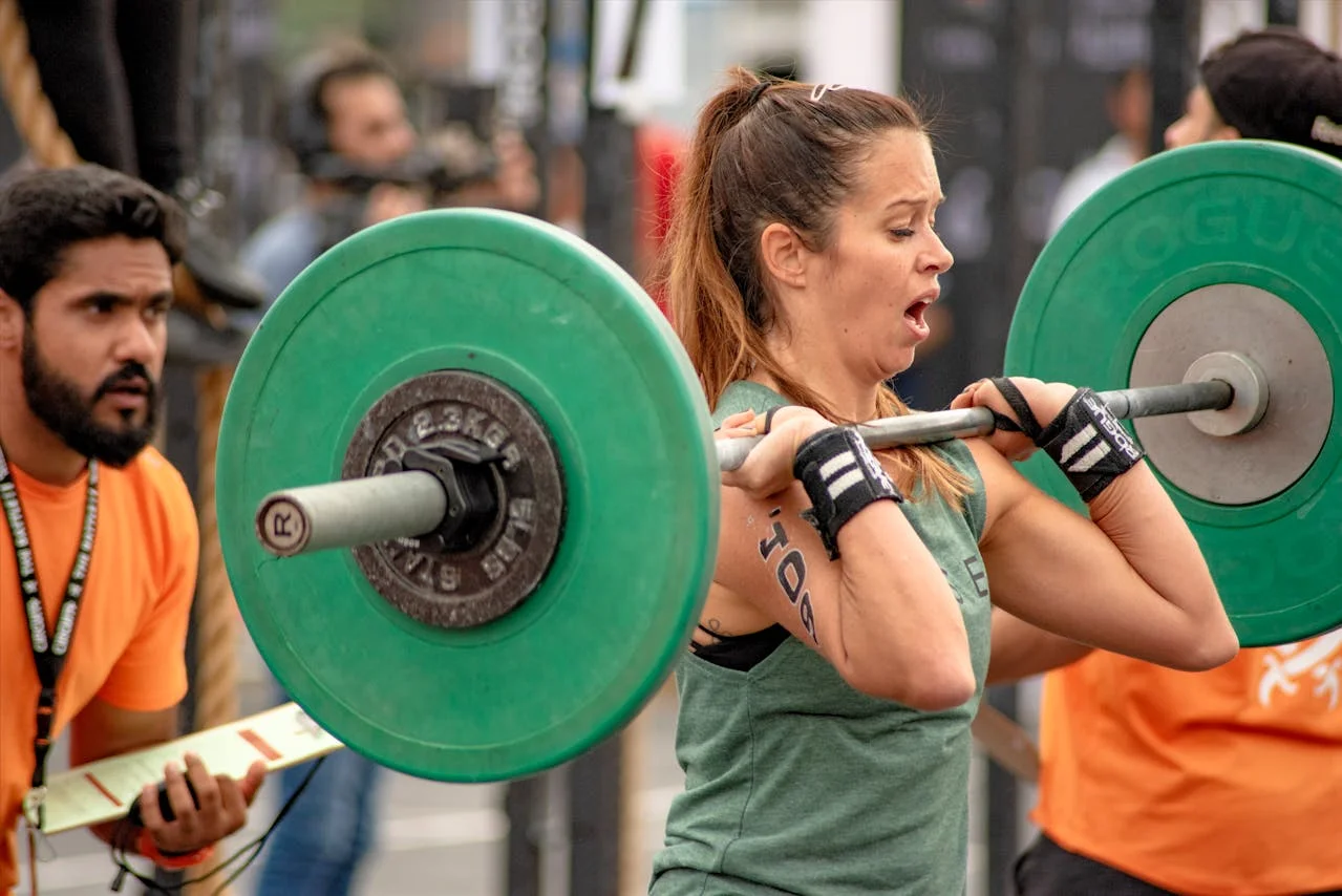 CrossFit athlete at a competition with a judge