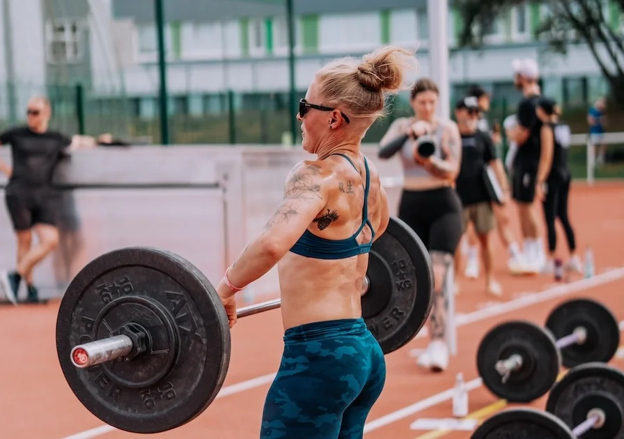 Female athlete doing barbell exercises