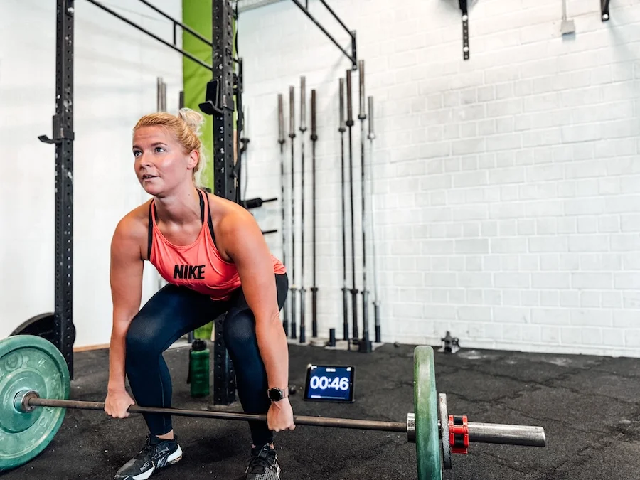 Female athlete doing deadlifts