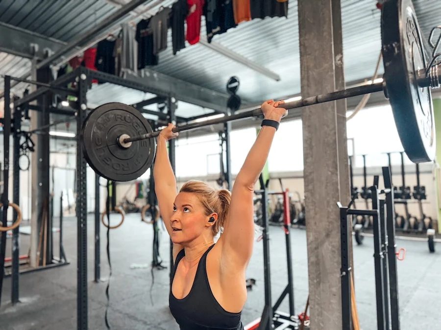 Female athlete lifting a barbell