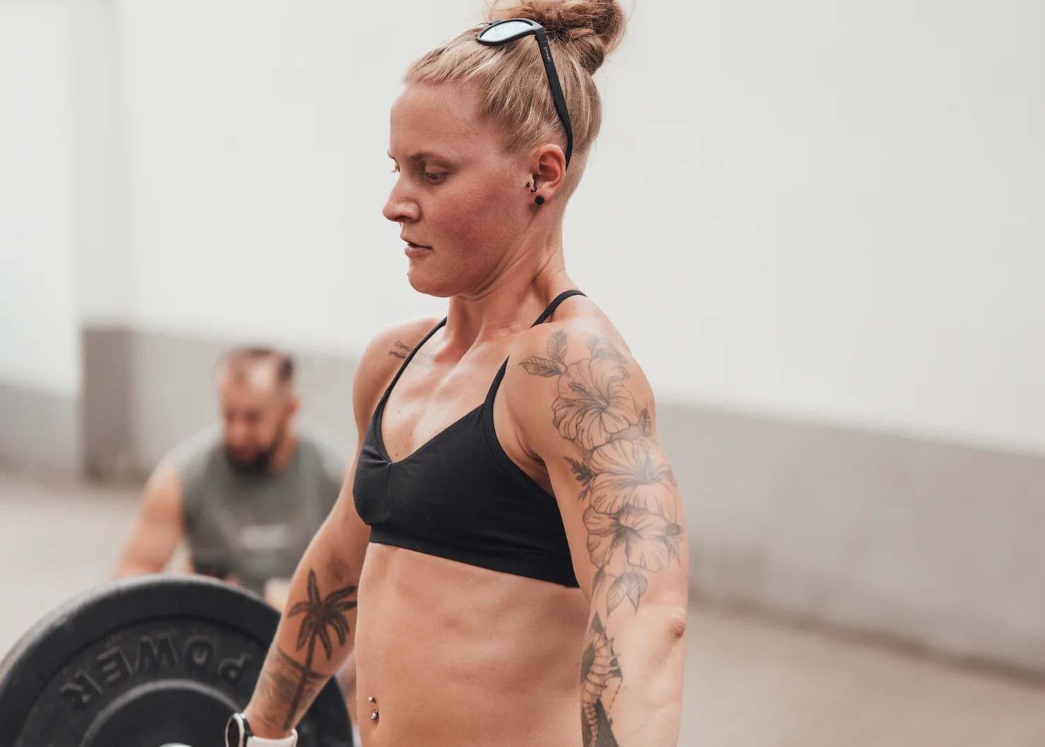 Female athlete training with a barbell