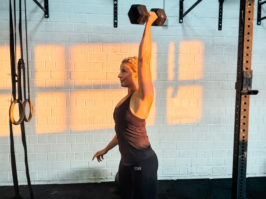 woman training with a dumbbell