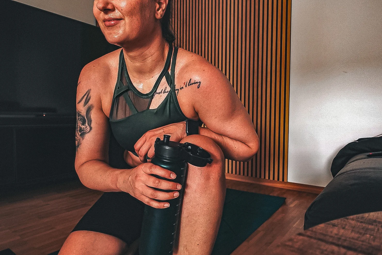 Female athlete with a water bottle