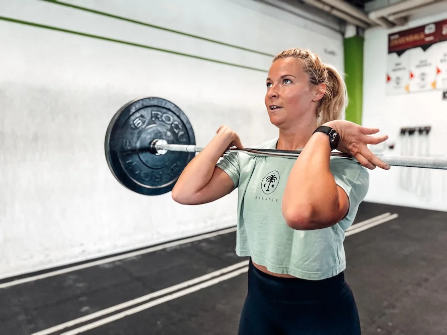 Woman training with a barbell
