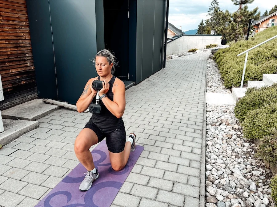 Woman training with a dumbbell