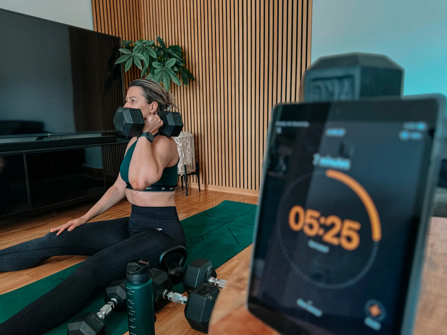 Woman training with a dumbbell