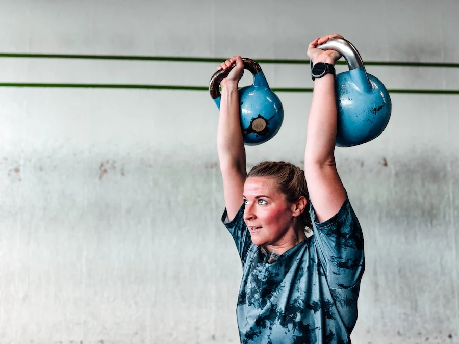 woman training with kettlebells